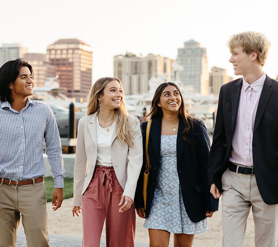 Students from the business administration BSBA program walk along the intercoastal in West Palm Beach.